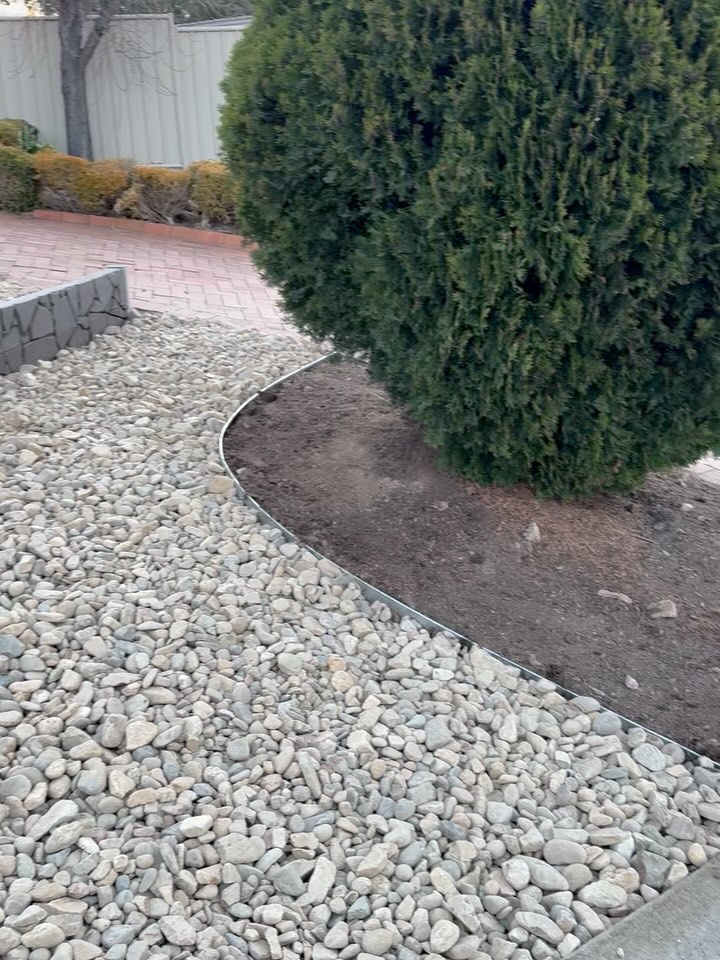 River stone garden edging with steel border